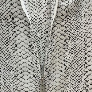 Michael Kors blouse/jacket,size L, 100 percent polyester.